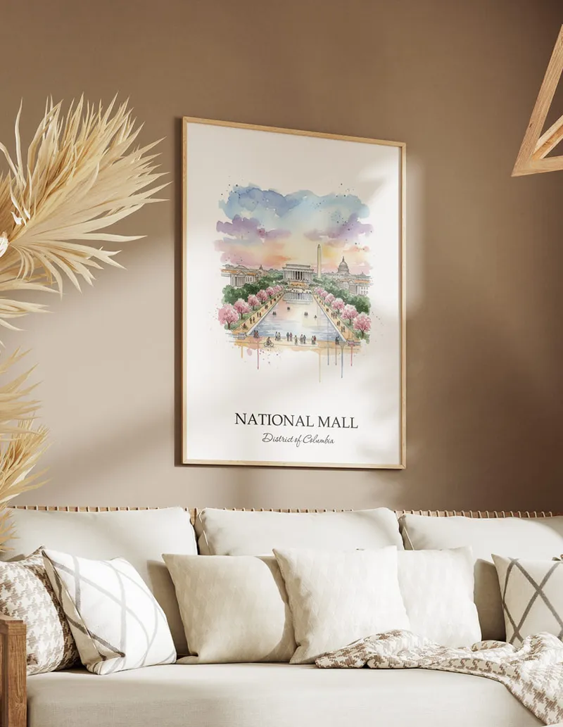 Cozy, well-lit workspace with a minimalist poster of National Mall, District of Columbia in a light frame sitting on the desk.