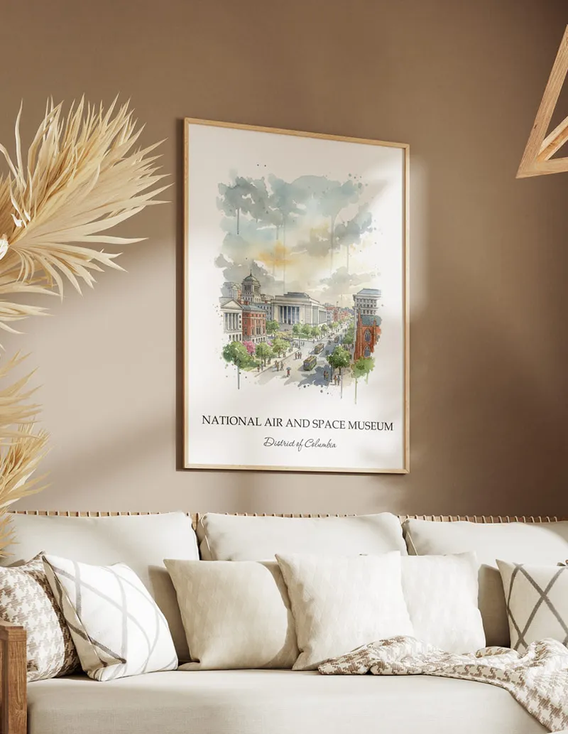 Cozy, well-lit workspace with a minimalist poster of National Air and Space Museum, District of Columbia in a light frame sitting on the desk.