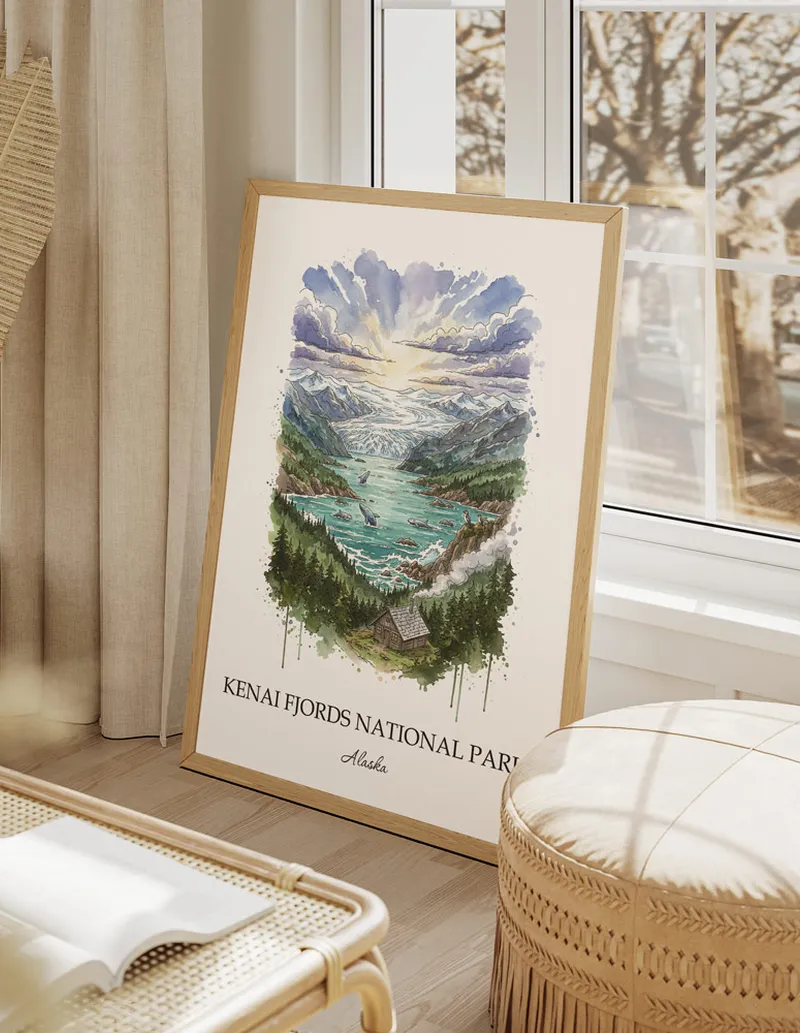 Vintage travel poster of Kenai Fjords National Park, Alaska in a light frame displayed above a sofa in a bright boho interior.