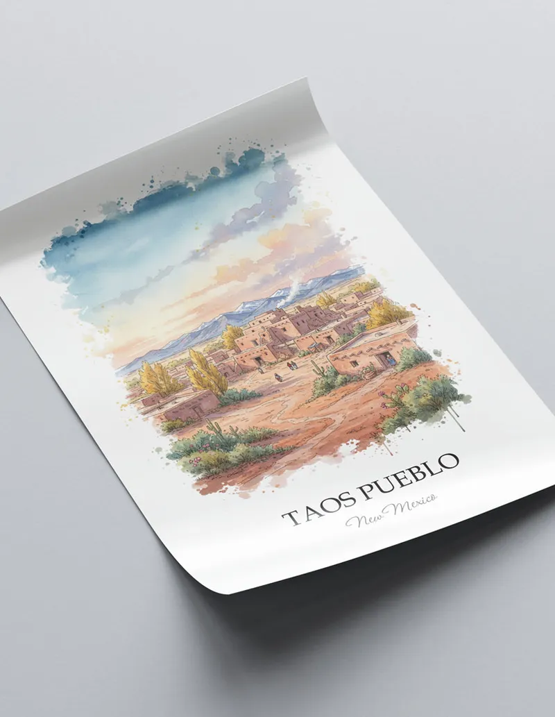 Minimalist poster of Taos Pueblo in New Mexico in a light frame standing on the floor in a dark moody interior.