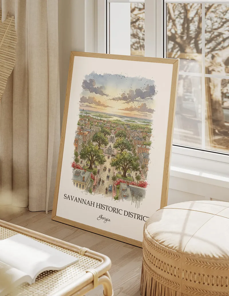 Vintage travel poster of Savannah Historic District, Georgia in a light frame displayed above a sofa in a bright boho interior.
