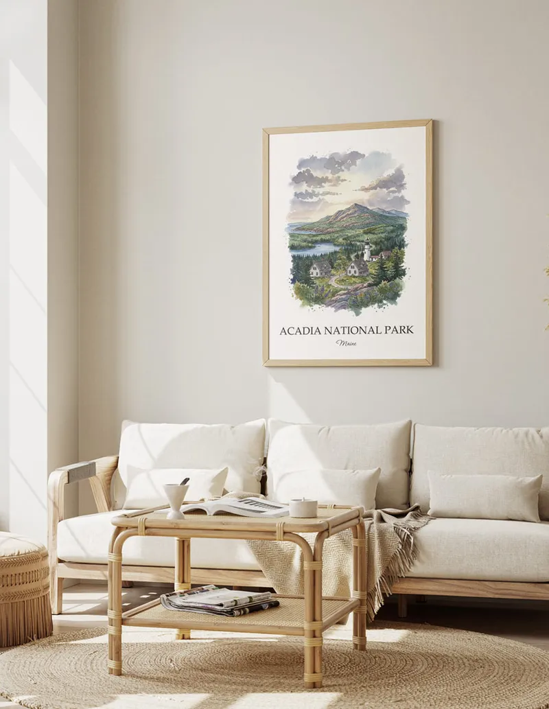 A gorgeous boho-inspired living space with a framed vintage travel poster of Acadia National Park in Maine on display.