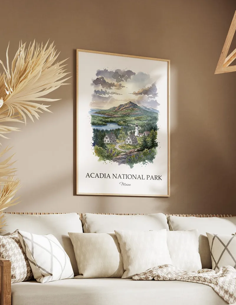 Cozy, well-lit workspace with a minimalist poster of Acadia National Park, Maine in a light frame sitting on the desk.