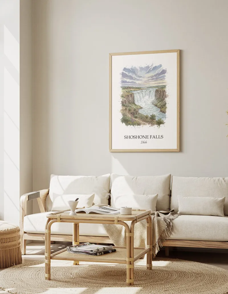 A gorgeous boho-inspired living space with a framed vintage travel poster of Shoshone Falls in Idaho on display.