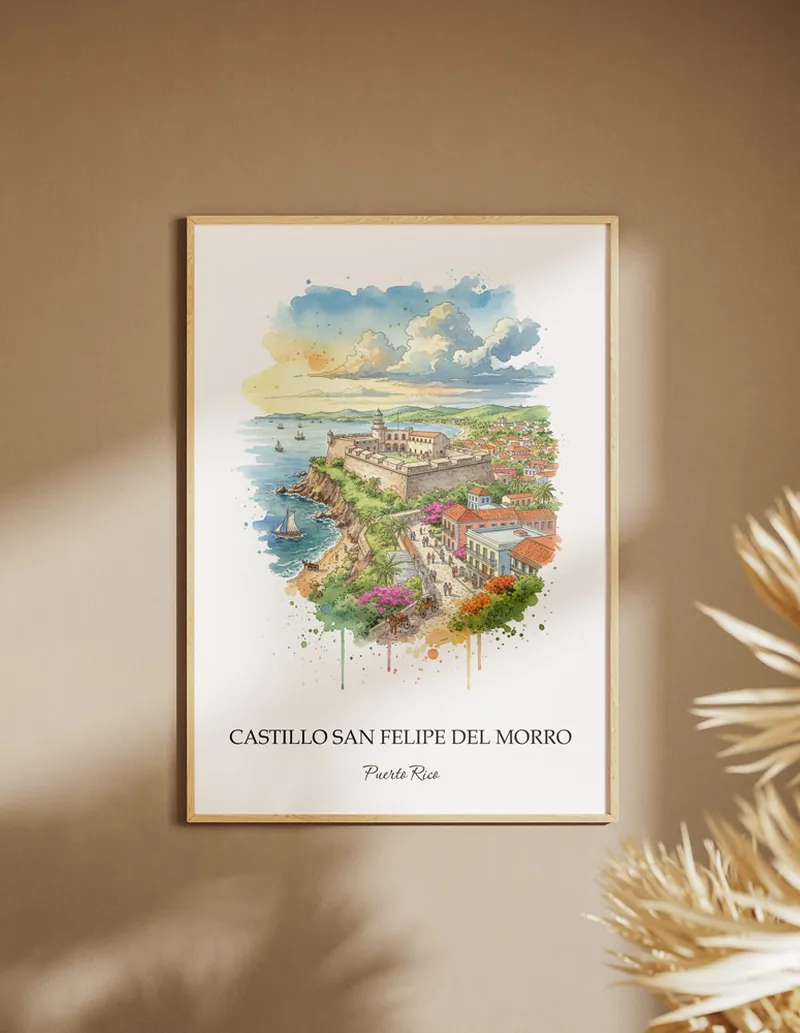 Framed wall art featuring Castillo San Felipe del Morro in Puerto Rico in a light wood frame leaning on the floor.