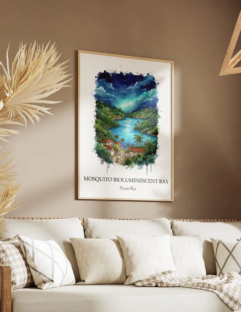 Cozy, well-lit workspace with a minimalist poster of Mosquito Bioluminescent Bay, Puerto Rico in a light frame sitting on the desk.