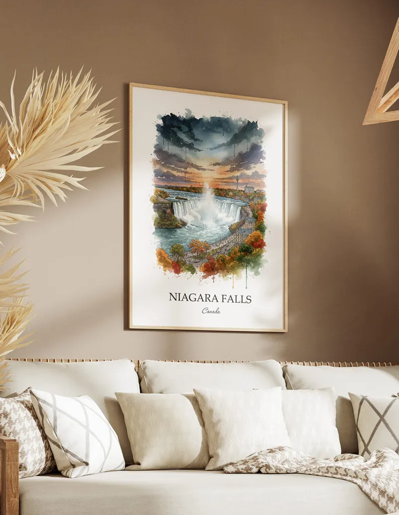 Cozy, well-lit workspace with a minimalist poster of Niagara Falls, Canada in a light frame sitting on the desk.