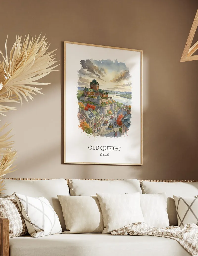 Cozy, well-lit workspace with a minimalist poster of Old Quebec, Canada in a light frame sitting on the desk.