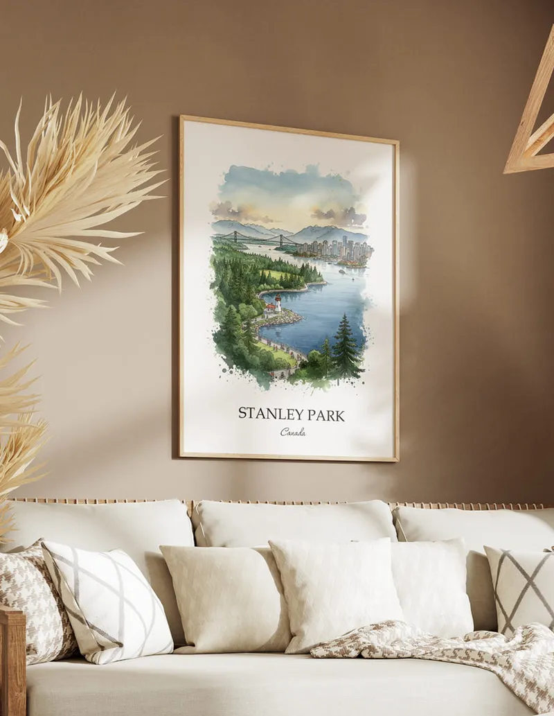 Cozy, well-lit workspace with a minimalist poster of Stanley Park, Canada in a light frame sitting on the desk.