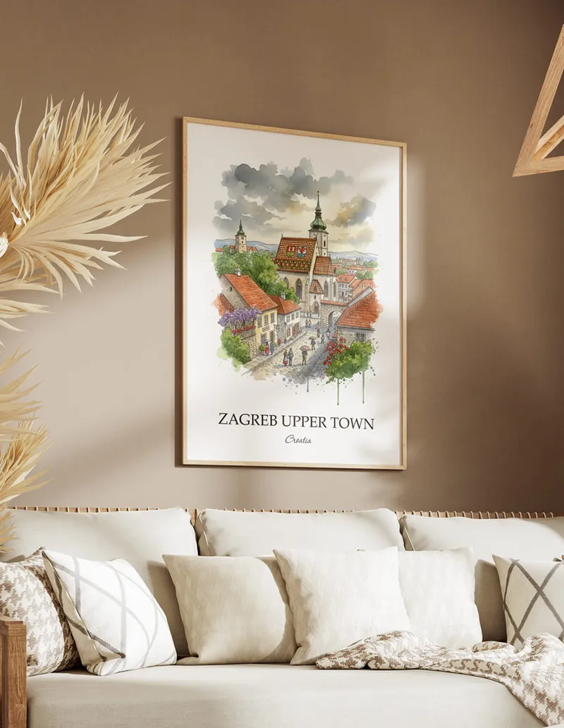 Vintage travel poster of Zagreb Upper Town, Croatia in a light frame displayed above a sofa in a bright boho interior.