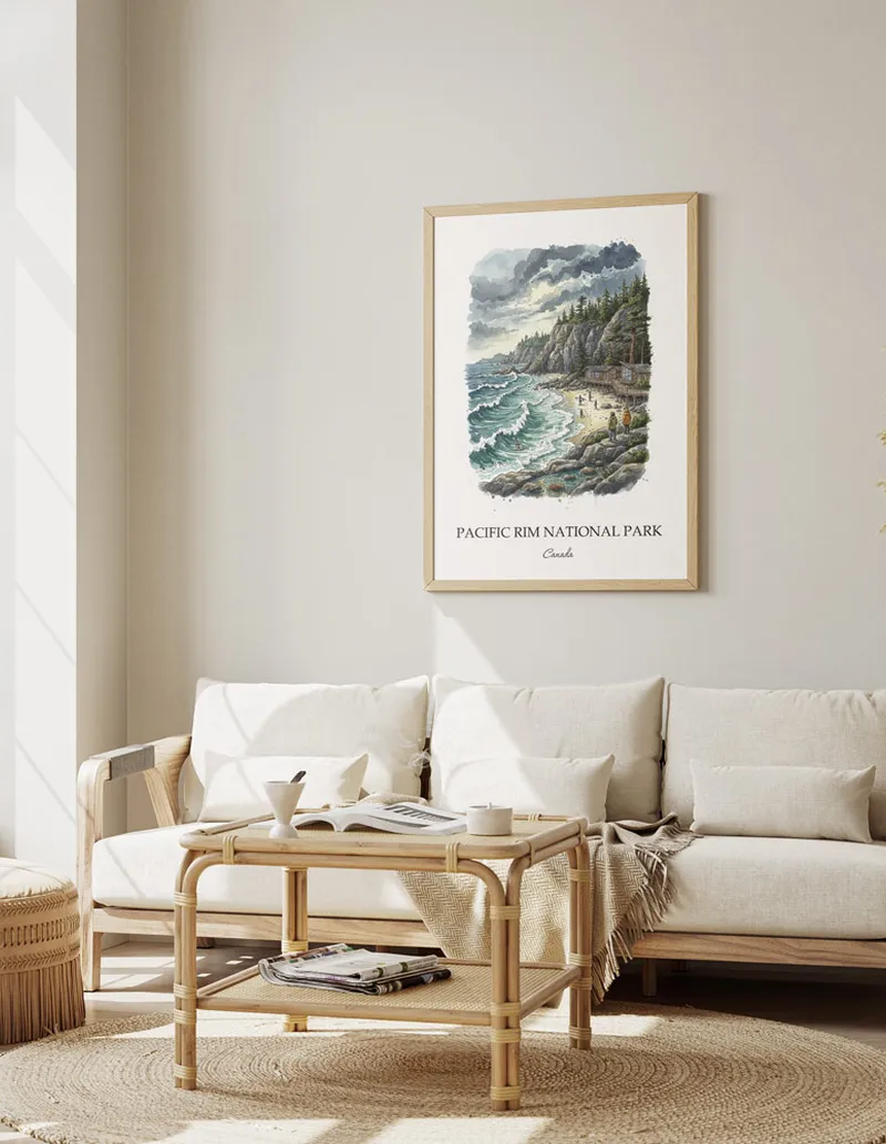 A gorgeous boho-inspired living space with a framed vintage travel poster of Pacific Rim National Park in Canada on display.