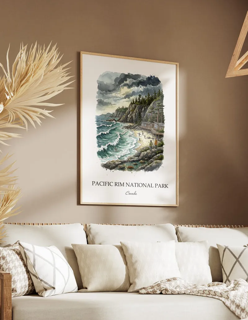 Cozy, well-lit workspace with a minimalist poster of Pacific Rim National Park, Canada in a light frame sitting on the desk.