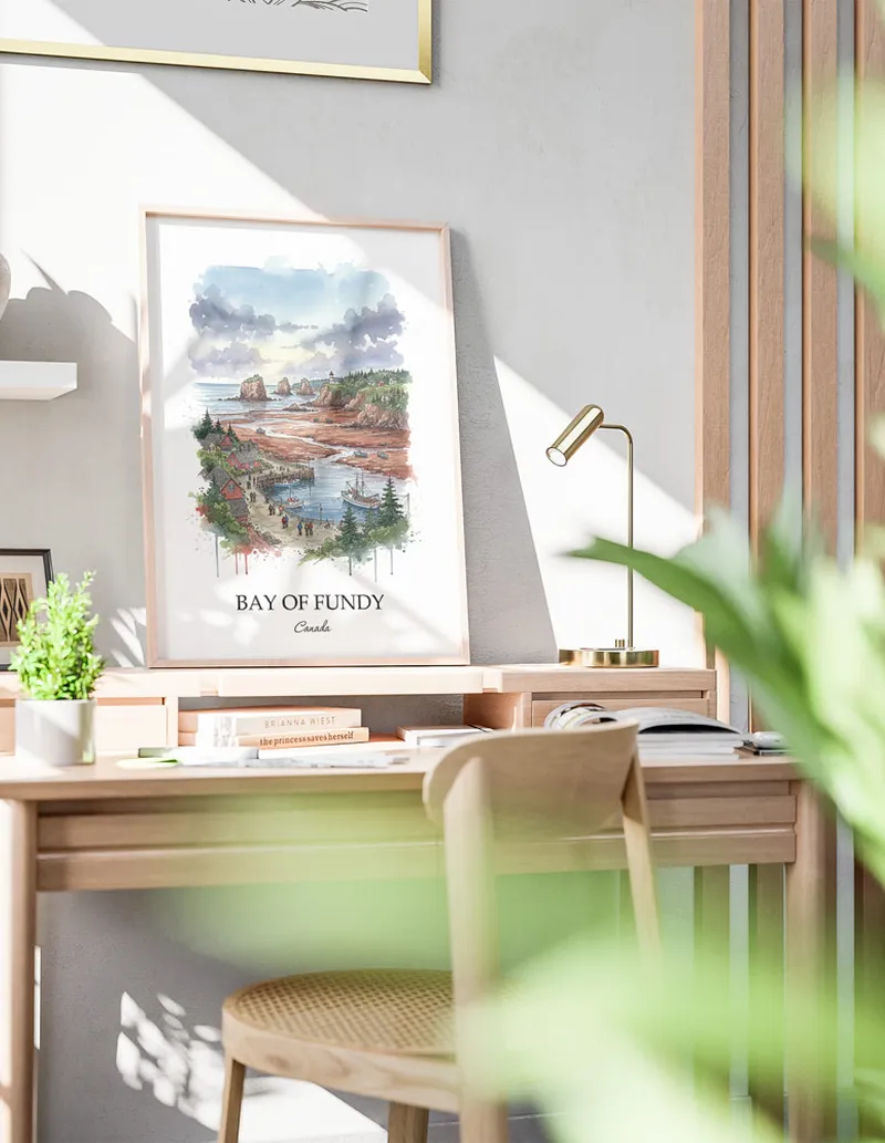 Framed wall art featuring Bay of Fundy in Canada in a light wood frame leaning on the floor.