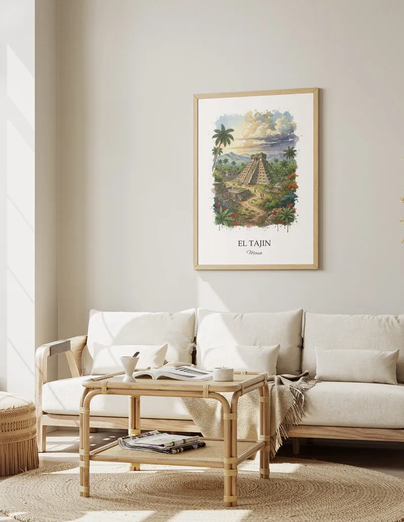 Cozy, well-lit workspace with a minimalist poster of El Tajin, Mexico in a light frame sitting on the desk.