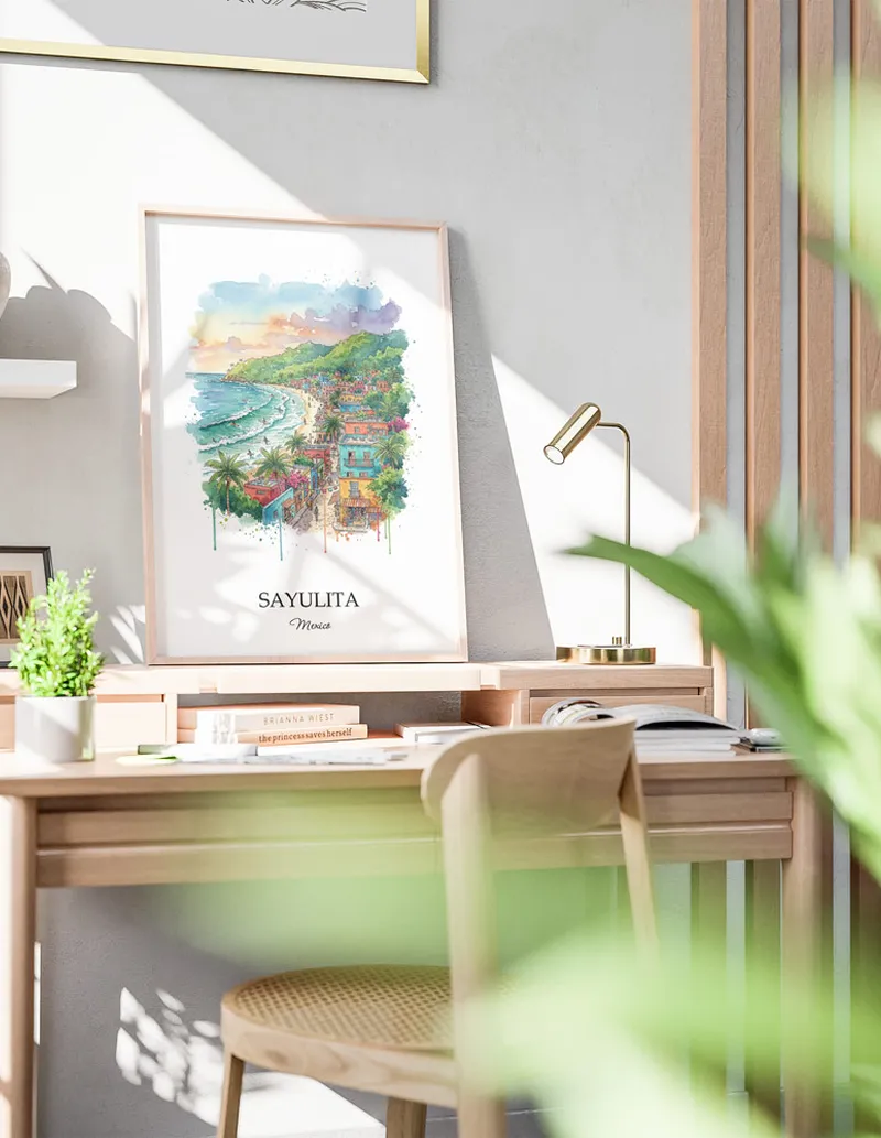 Framed wall art featuring Sayulita in Mexico in a light wood frame leaning on the floor.