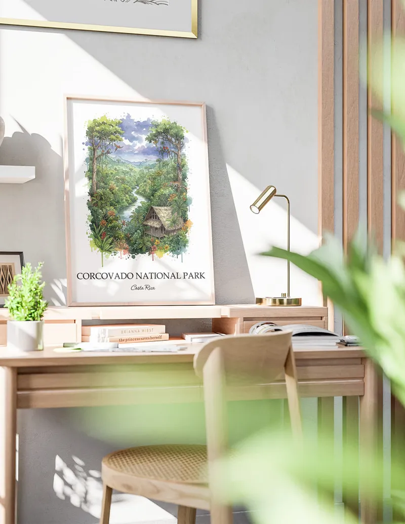 Framed wall art featuring Corcovado National Park in Costa Rica in a light wood frame leaning on the floor.