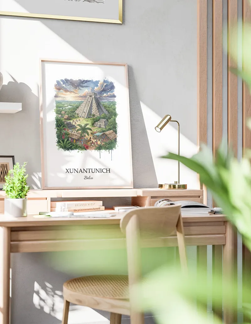 Framed wall art featuring Xunantunich in Belize in a light wood frame leaning on the floor.