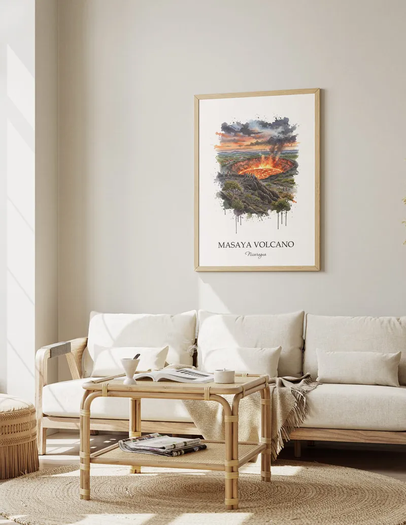 Cozy, well-lit workspace with a minimalist poster of Masaya Volcano, Nicaragua in a light frame sitting on the desk.