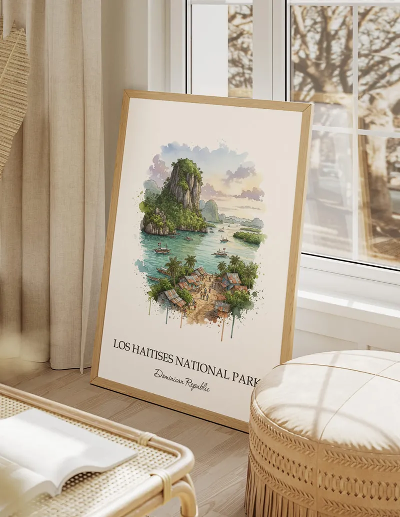 A gorgeous boho-inspired living space with a framed vintage travel poster of Los Haitises National Park in Dominican Republic on display.