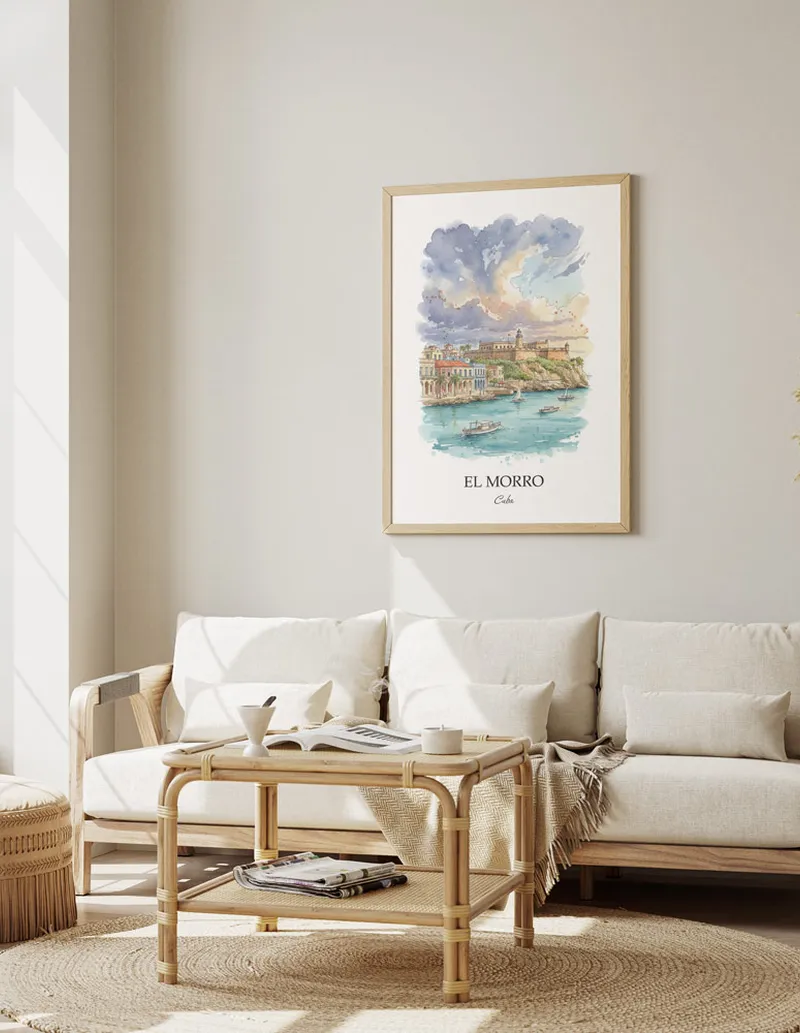 Cozy, well-lit workspace with a minimalist poster of El Morro, Cuba in a light frame sitting on the desk.