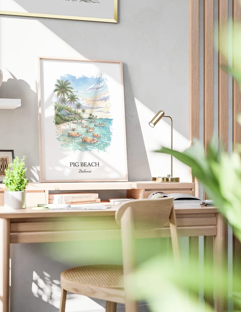 Framed wall art featuring Pig Beach in Bahamas in a light wood frame leaning on the floor.