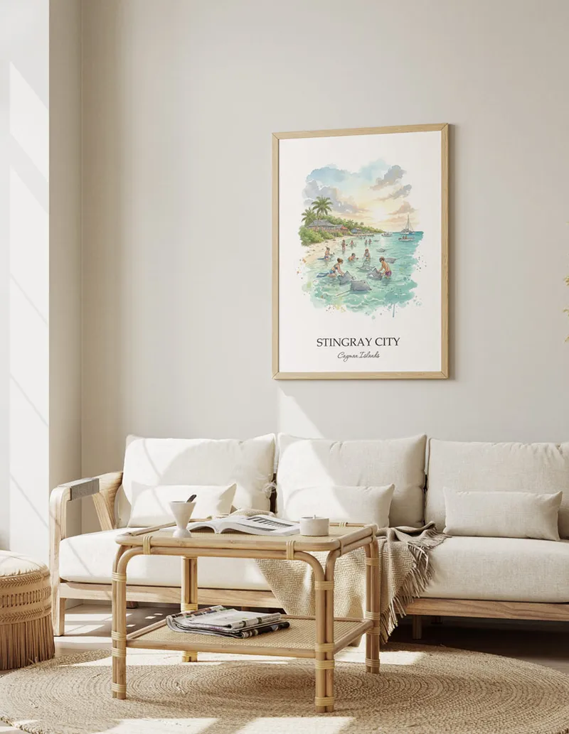 Cozy, well-lit workspace with a minimalist poster of Stingray City, Cayman Islands in a light frame sitting on the desk.