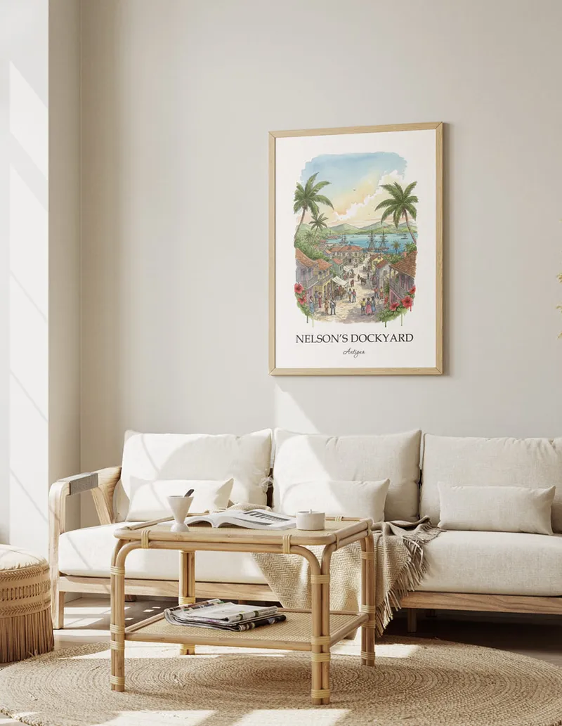 Cozy, well-lit workspace with a minimalist poster of Nelson's Dockyard, Antigua in a light frame sitting on the desk.