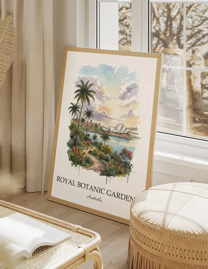 A gorgeous boho-inspired living space with a framed vintage travel poster of Royal Botanic Gardens in Australia on display.