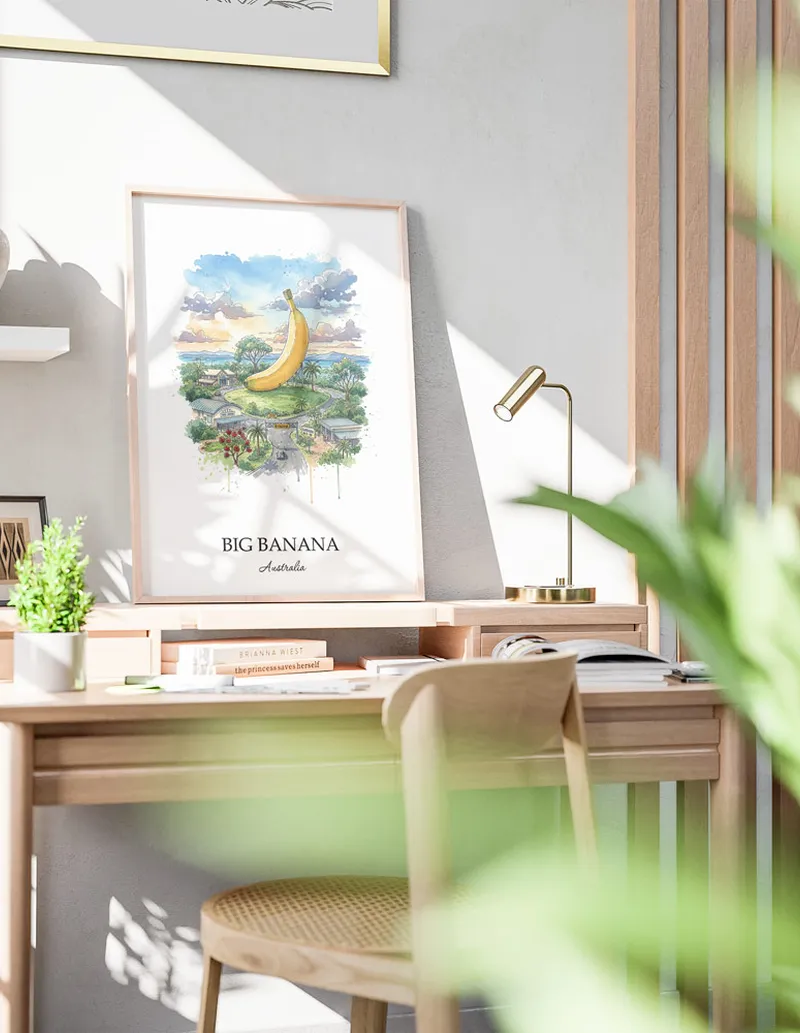 Framed wall art featuring Big Banana in Australia in a light wood frame leaning on the floor.