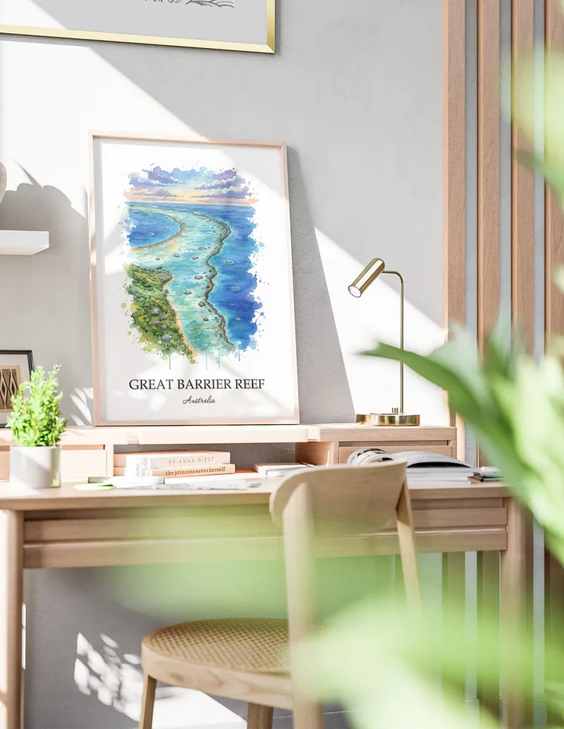 Framed wall art featuring Great Barrier Reef in Australia in a light wood frame leaning on the floor.