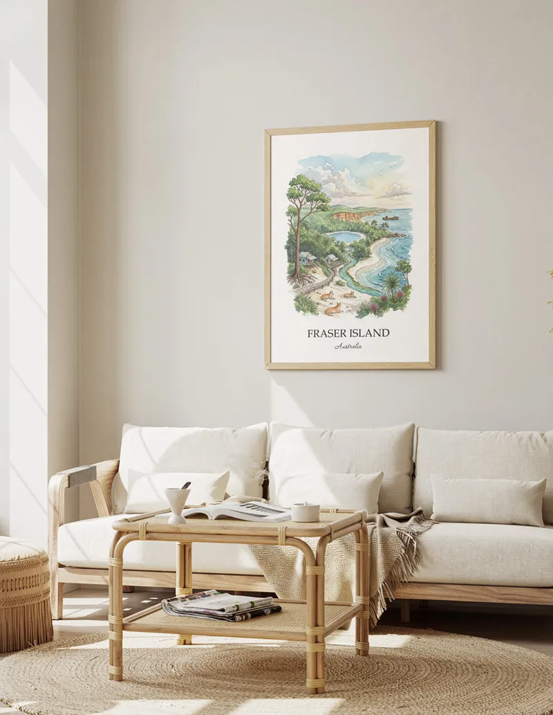 Cozy, well-lit workspace with a minimalist poster of Fraser Island, Australia in a light frame sitting on the desk.