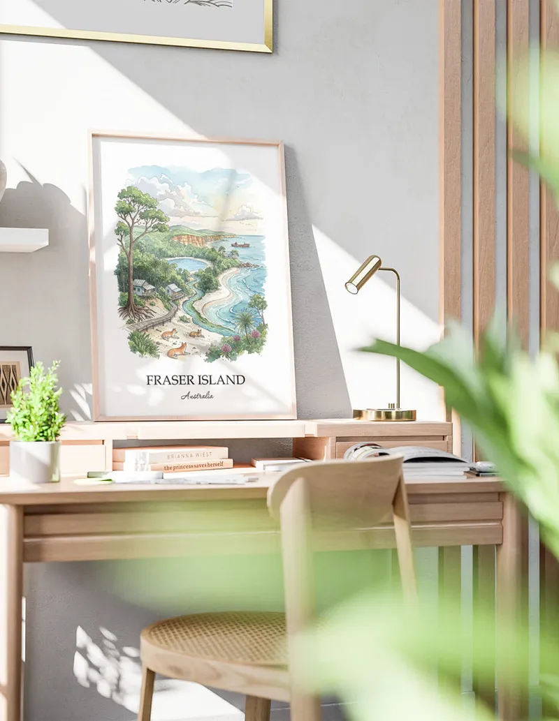 Framed wall art featuring Fraser Island in Australia in a light wood frame leaning on the floor.