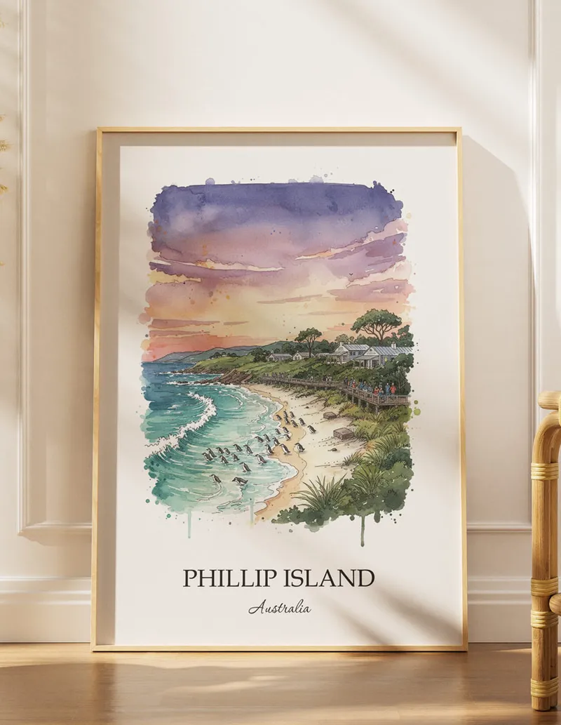 Framed wall art featuring Phillip Island, Australia in a light wood frame hanging above a sofa in a modern living room.