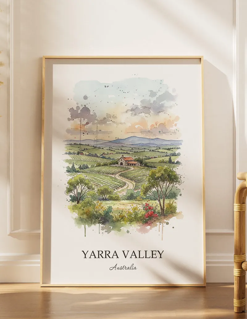 Framed wall art featuring Yarra Valley, Australia in a light wood frame hanging above a sofa in a modern living room.
