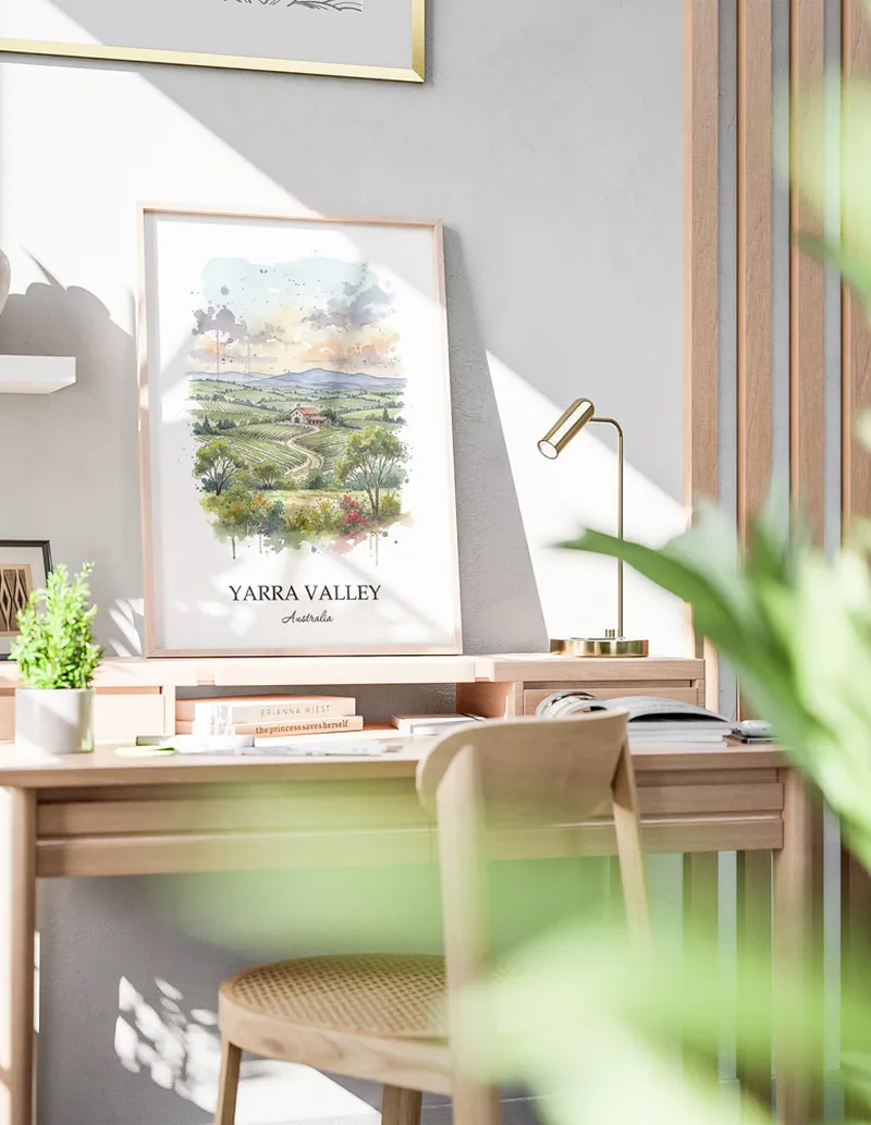 Minimalist poster of Yarra Valley in Australia in a light frame standing on the floor in a dark moody interior.