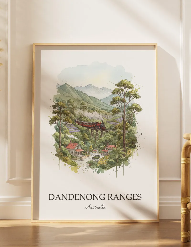 Framed wall art featuring Dandenong Ranges, Australia in a light wood frame hanging above a sofa in a modern living room.