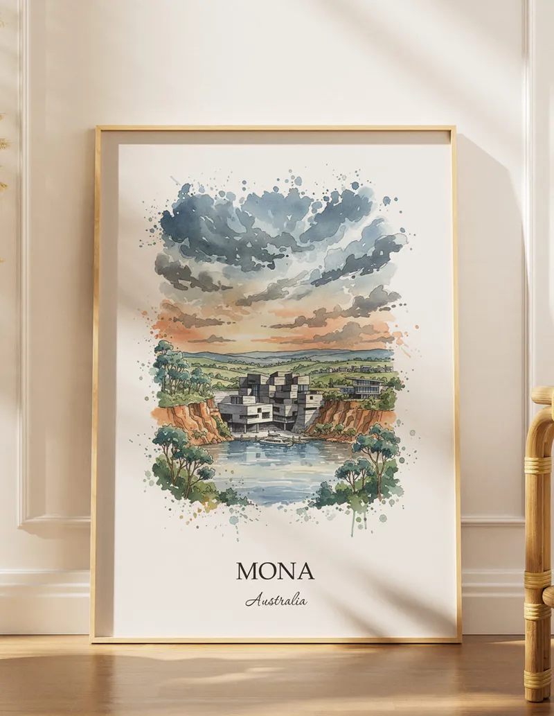 Framed wall art featuring MONA, Australia in a light wood frame hanging above a sofa in a modern living room.