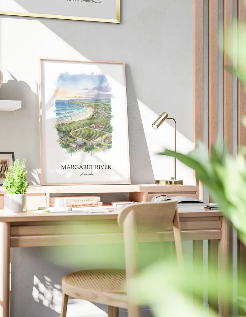 Minimalist poster of Margaret River in Australia in a light frame standing on the floor in a dark moody interior.