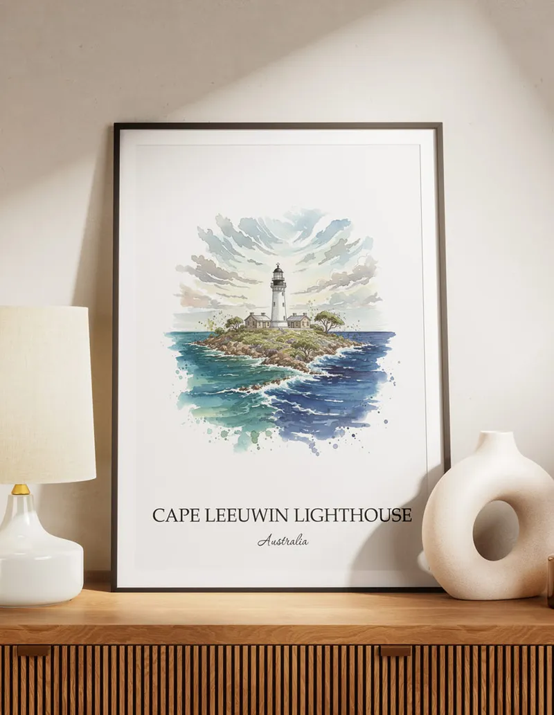 Cozy, well-lit workspace with a minimalist poster of Cape Leeuwin Lighthouse, Australia in a light frame sitting on the desk.