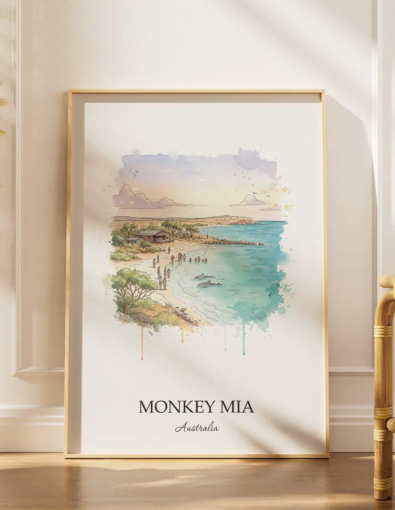Vintage travel poster of Monkey Mia, Australia in a light frame displayed above a sofa in a bright boho interior.