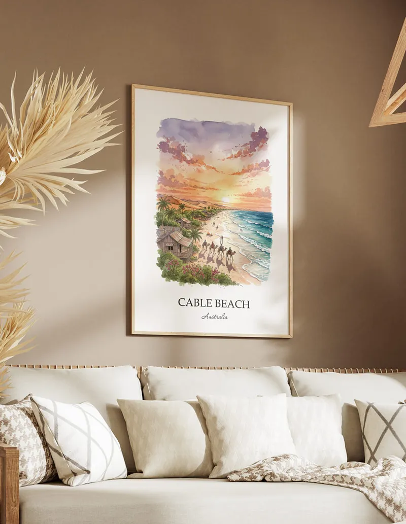 Framed wall art featuring Cable Beach in Australia in a light wood frame leaning on the floor.