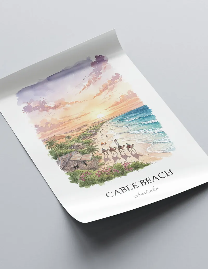 Framed wall art featuring Cable Beach, Australia in a light wood frame hanging above a sofa in a modern living room.