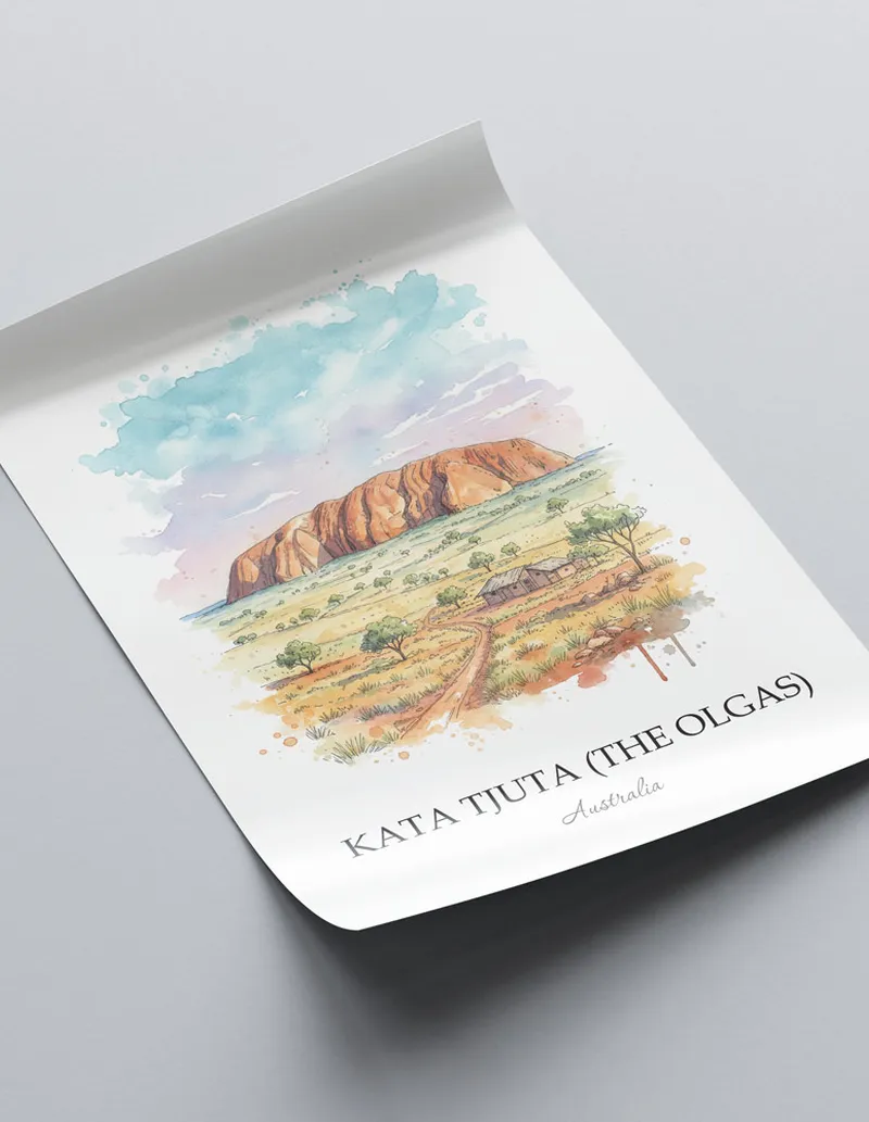 Framed wall art featuring Kata Tjuta, Australia in a light wood frame hanging above a sofa in a modern living room.
