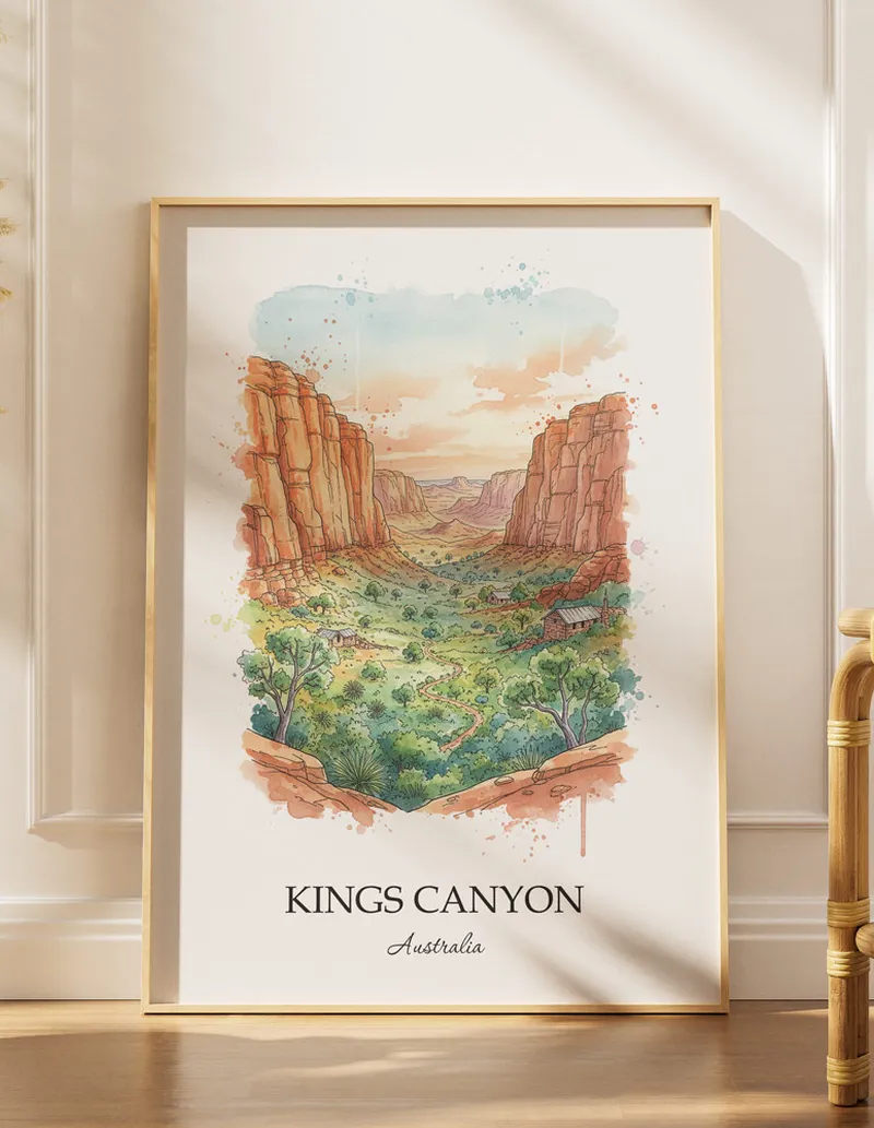 Vintage travel poster of Kings Canyon, Australia in a light frame displayed above a sofa in a bright boho interior.