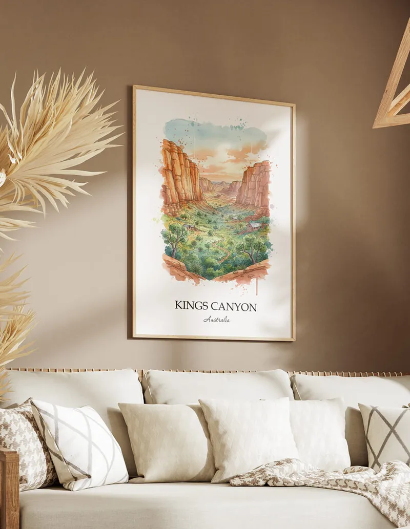 Framed wall art featuring Kings Canyon in Australia in a light wood frame leaning on the floor.