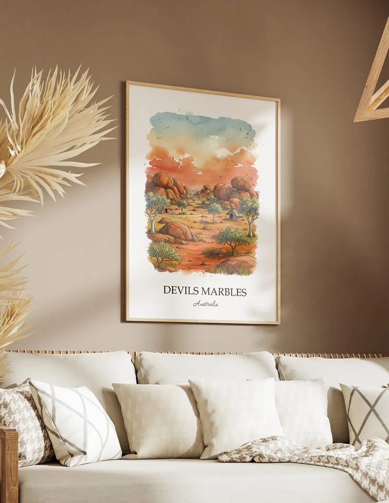 Framed wall art featuring Devils Marbles in Australia in a light wood frame leaning on the floor.
