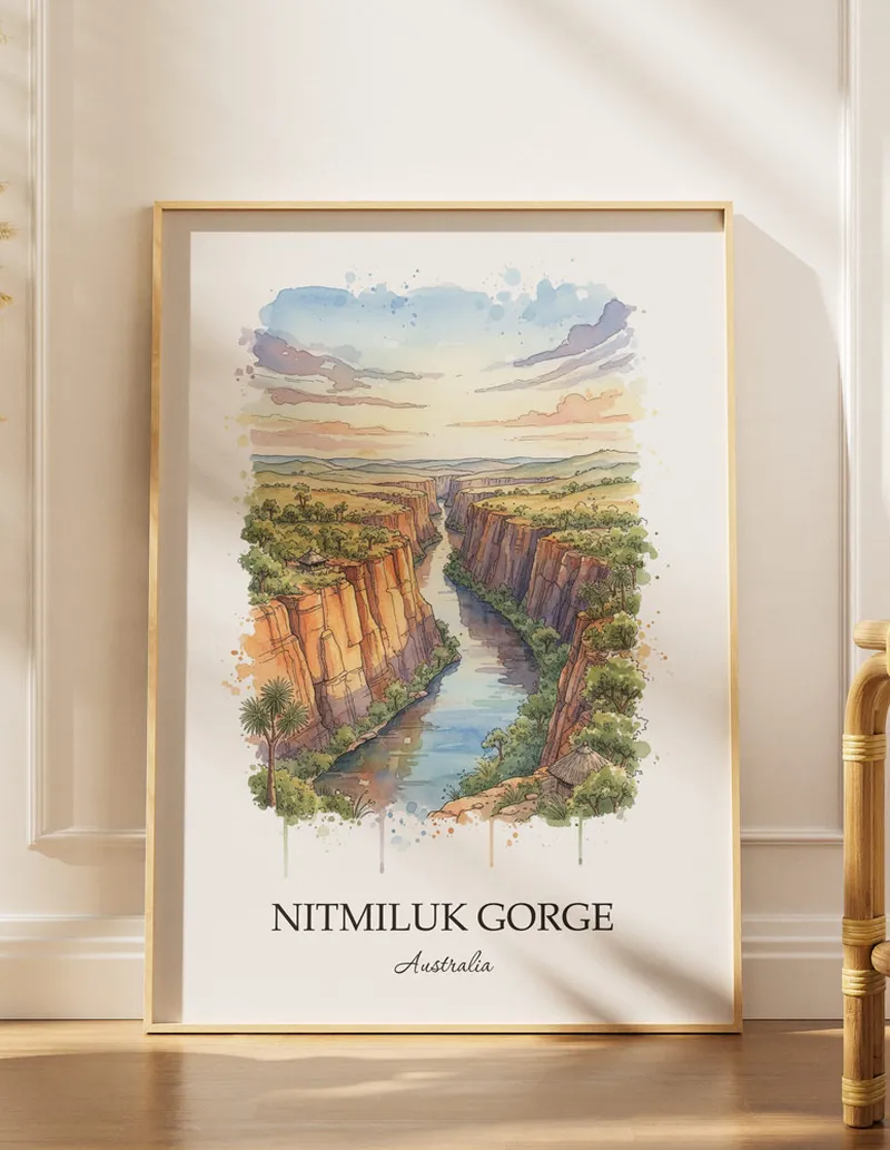 Vintage travel poster of Nitmiluk Gorge, Australia in a light frame displayed above a sofa in a bright boho interior.