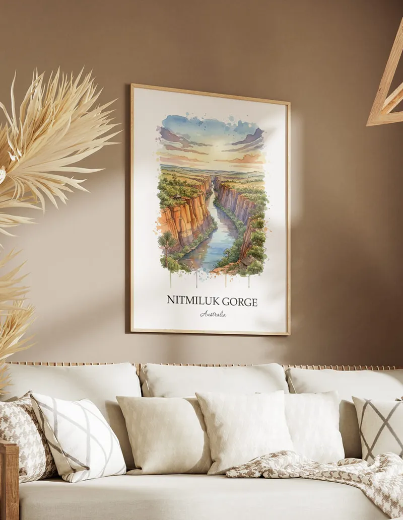 Framed wall art featuring Nitmiluk Gorge in Australia in a light wood frame leaning on the floor.