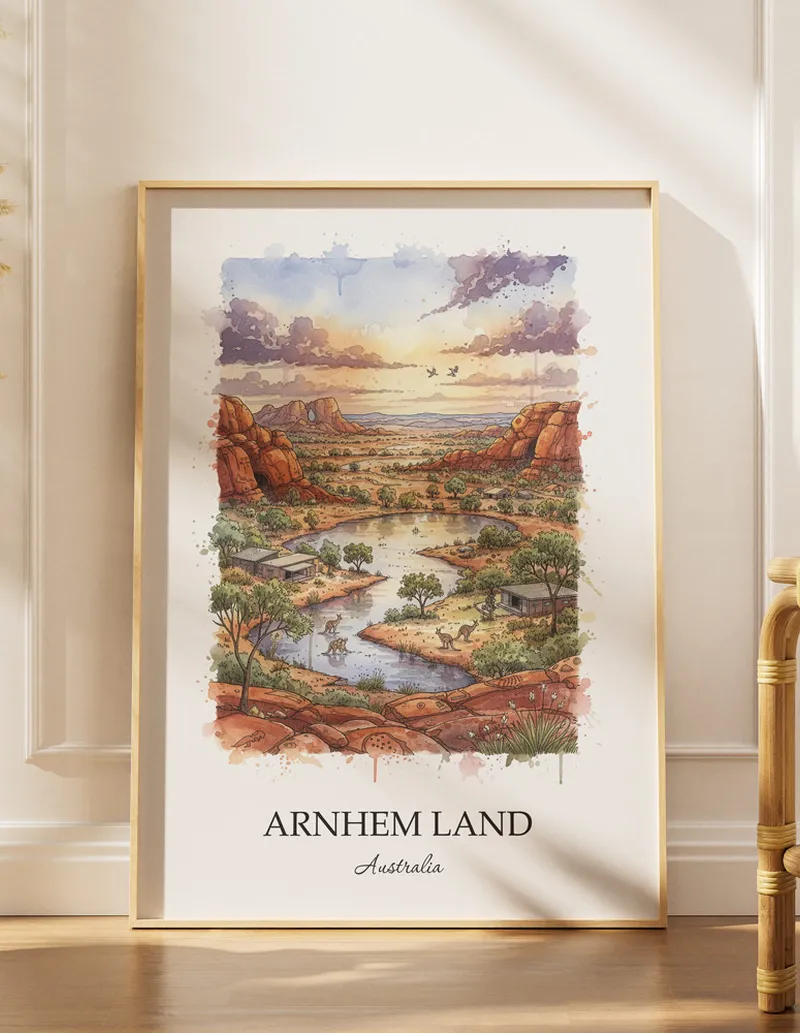 Vintage travel poster of Arnhem Land, Australia in a light frame displayed above a sofa in a bright boho interior.