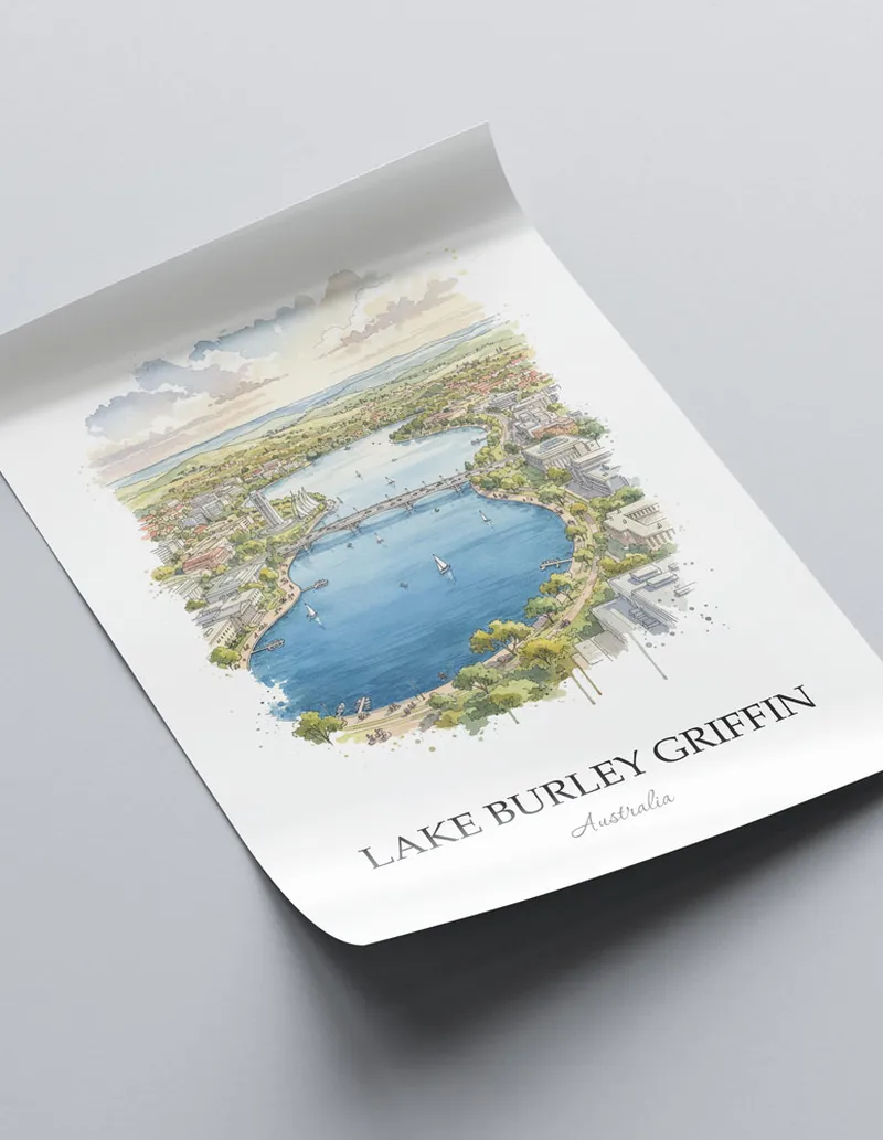 Framed wall art featuring Lake Burley Griffin, Australia in a light wood frame hanging above a sofa in a modern living room.